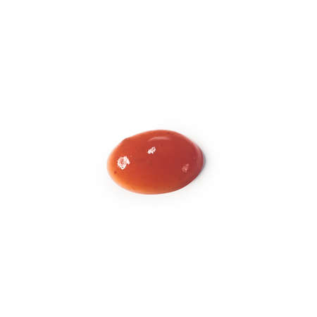 Drop of red sauce or ketchup isolated on white background close-up macro.の写真素材