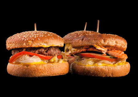 Set of different burgers isolated on black background. Hamburger, cheeseburger and fish burger.の写真素材