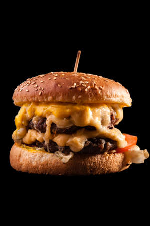 Burger isolated on black background.の写真素材