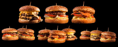 Burgers set isolated on black background. Hamburger, cheeseburger and fish burger for the restaurant menu.の写真素材