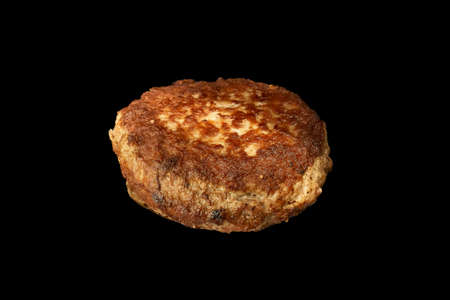 Fried meat cutlet isolated on black background burger ingredient.の写真素材