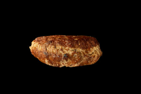 Fried meat cutlet isolated on black background burger ingredient.の写真素材