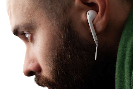Conceptual photo of cut off the earphones wire. headphones are a new trend. Wireless technologies are advancing. Wireless mobile headset.の写真素材