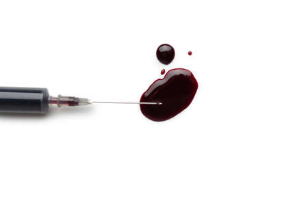 Bloody syringe isolated on white background.の写真素材