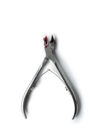 Bloody nail pliers isolated on white background.の写真素材
