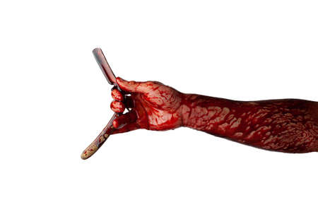Bloody hand with straight razor isolated on white background.の写真素材