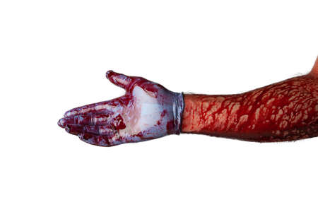 Bloody hand in medical gloves isolated on white background.の写真素材