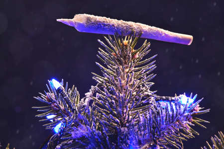 Festive Christmas tree with a jamb of marijuana in the form of a Christmas tree toy.の写真素材