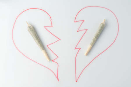 Love marijuana culture concept. Joint hemp and a drawn heart on a marker board.の写真素材