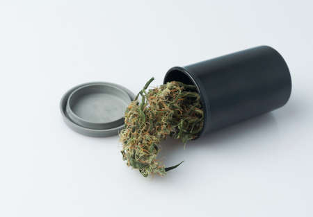 Cannabis bud in packaging on a white background. Medical cannabis drug.の写真素材