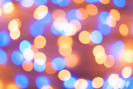 Festive garland bokeh background defocused. Background for greeting cards and postcards. Round bokeh balls. Round bokeh light.の写真素材