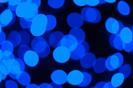 Festive garland bokeh background defocused. Background for greeting cards and postcards. Round bokeh balls. Round bokeh light.の写真素材