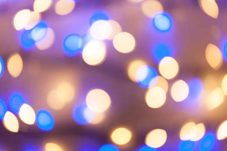 Festive garland bokeh background defocused. Background for greeting cards and postcards. Round bokeh balls. Round bokeh light.の写真素材