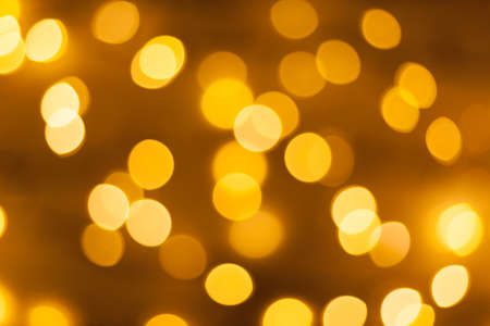 Festive garland bokeh background defocused. Background for greeting cards and postcards. Round bokeh balls. Round bokeh light.の写真素材
