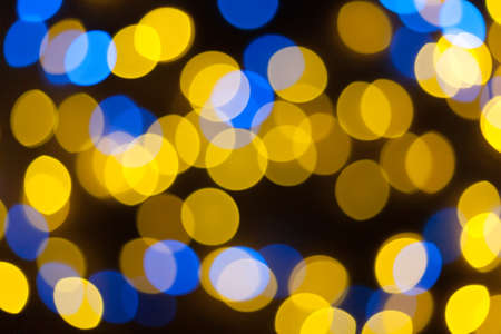 Festive garland bokeh background defocused. Background for greeting cards and postcards. Round bokeh balls. Round bokeh light.の写真素材