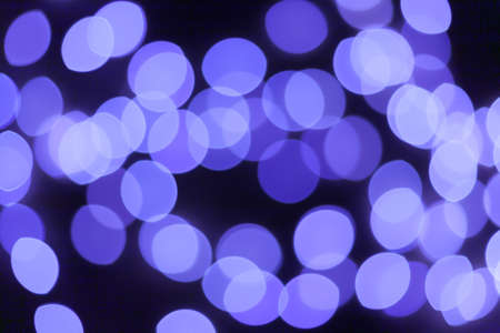 Festive garland bokeh background defocused. Background for greeting cards and postcards. Round bokeh balls. Round bokeh light.の写真素材
