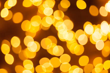 Festive garland bokeh background defocused. Background for greeting cards and postcards. Round bokeh balls. Round bokeh light.の写真素材