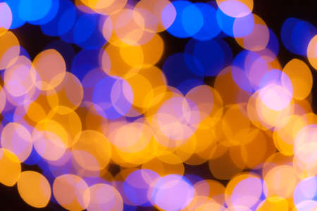 Festive garland bokeh background defocused. Background for greeting cards and postcards. Round bokeh balls. Round bokeh light.の写真素材