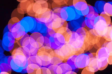 Festive garland bokeh background defocused. Background for greeting cards and postcards. Round bokeh balls. Round bokeh light.の写真素材
