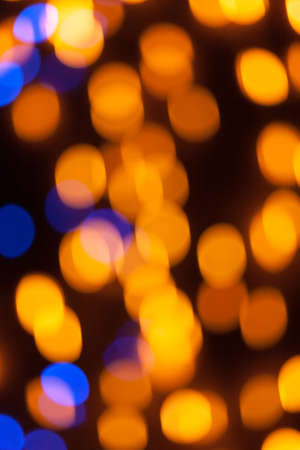 Festive garland bokeh background defocused. Background for greeting cards and postcards. Round bokeh balls. Round bokeh light.の写真素材