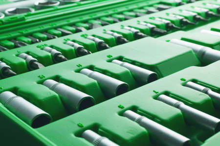 Mechanics Tool Set and Mechanic's Tool Box close-up. Plastic green Storage Box Case. Mechanics Tool Kit. Tool Box with Tools.の写真素材