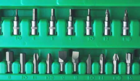 Mechanics Tool Set and Mechanic's Tool Box close-up. Plastic green Storage Box Case. Mechanics Tool Kit. Tool Box with Tools.の写真素材