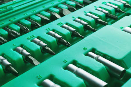Mechanics Tool Set and Mechanic's Tool Box close-up. Plastic green Storage Box Case. Mechanics Tool Kit. Tool Box with Tools.の写真素材