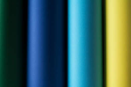 Colored paper in rolls multicolored cylindrical cardboard.の写真素材