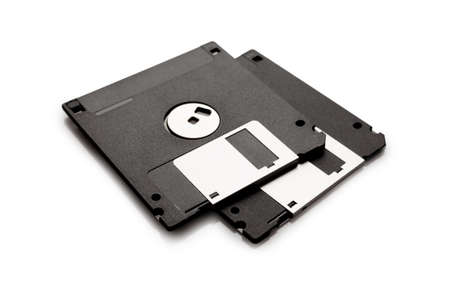 Floppy disk from black plastic isolated on white background. Outdated technology. Data storage diskette.の写真素材