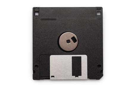 Floppy disk from black plastic isolated on white background. Outdated technology. Data storage diskette.の写真素材