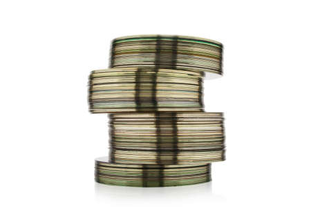 Stack of CD or DVD disk isolated on white background. Set collection pile of discs. Heap of data, information concept. Old technology.の写真素材