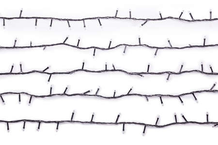 String of Christmas lights decoration black wire isolated on white background.の写真素材