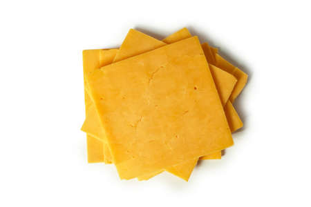 Slice of cheese cheddar isolated on a white background.の写真素材