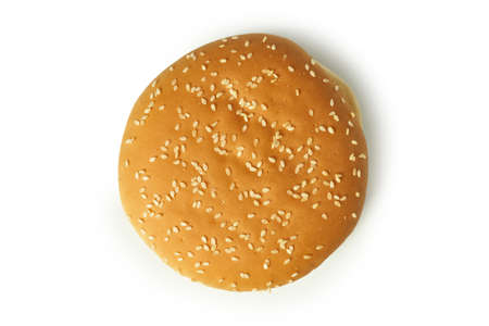 Round burger bun with sesame seeds isolated on white background.の写真素材