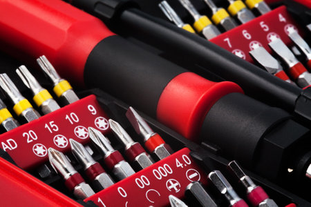 Set of metal heads for screwdriver in red box macro close up.の写真素材