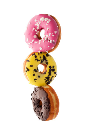Dessert in the form of glazed donuts in flight.の写真素材