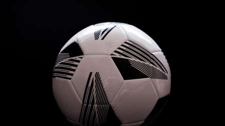 Soccer, football ball on a black dark background.