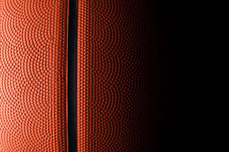Basketball rubber orange ball close-up texture background.の写真素材