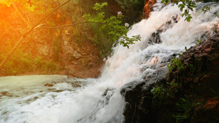 Beautiful small waterfall on the background of nature landscape.の写真素材