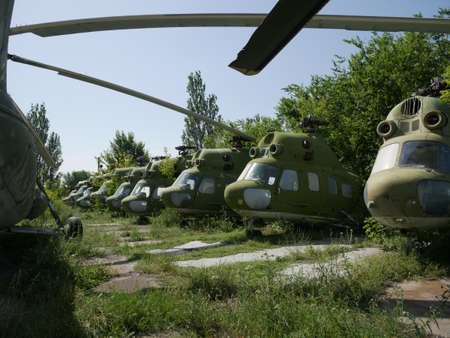 Old military abandoned helicopter. Broken non-working helicopter green.の写真素材