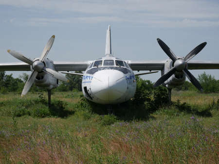 Old abandoned passenger plane. There is a broken plane in the wasteland.の写真素材