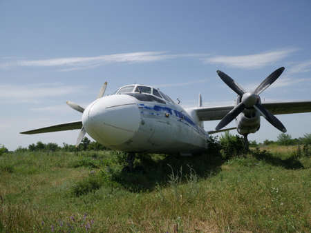 Old abandoned passenger plane. There is a broken plane in the wasteland.の写真素材