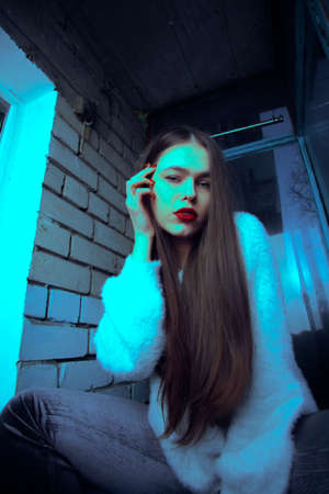 Art portrait with color correction young attractive girl model posing.の写真素材