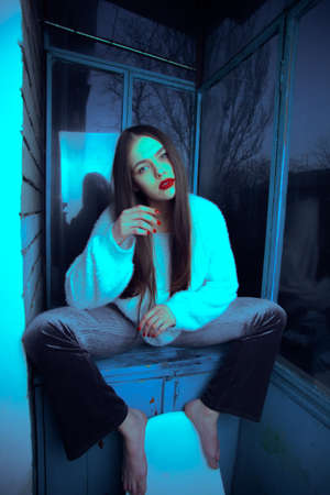 Art portrait with color correction young attractive girl model posing.の写真素材