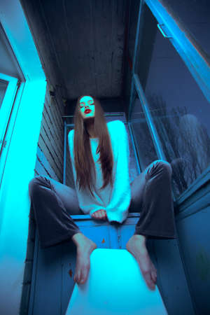 Art portrait with color correction young attractive girl model posing.の写真素材