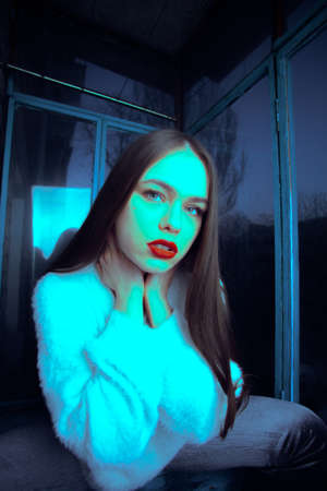 Art portrait with color correction young attractive girl model posing.の写真素材