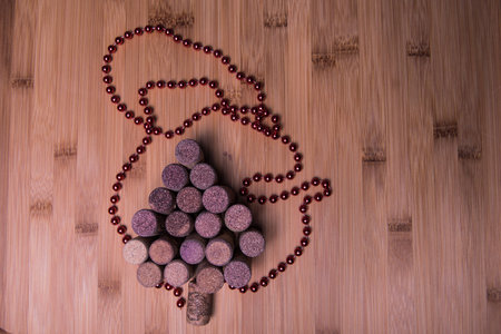 Wine corks shaped christmas tree on stone table. Top view with copy space for your text. Wine corks...