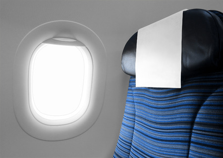 Blue seat beside window airplaneの写真素材