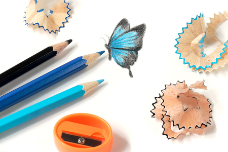 Colored pencil sharpening and butterfly drawingの写真素材