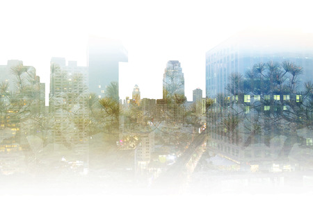 Double exposure photography capital city view and forest landscape, blue, green, purple pine tree on high building composite picture background, natural scenery backdropの写真素材